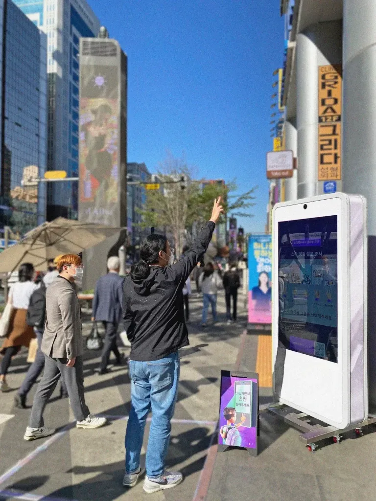 Person showing a gesture towards Fingerate bot