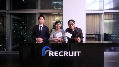 Recruit and GG56 employees standing next to each other