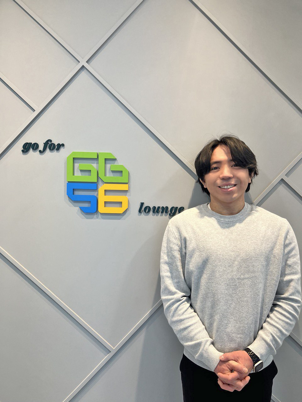 Picture of Jongwon Lee standing next to GG56 Korea Logo in Gangnam